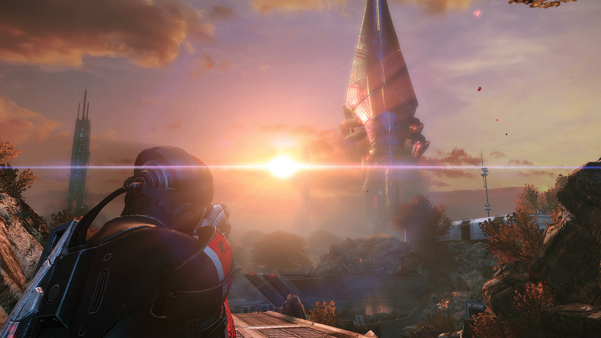 A soldier faces a Reaper on a sunlit horizon, a Legendary Edition still.