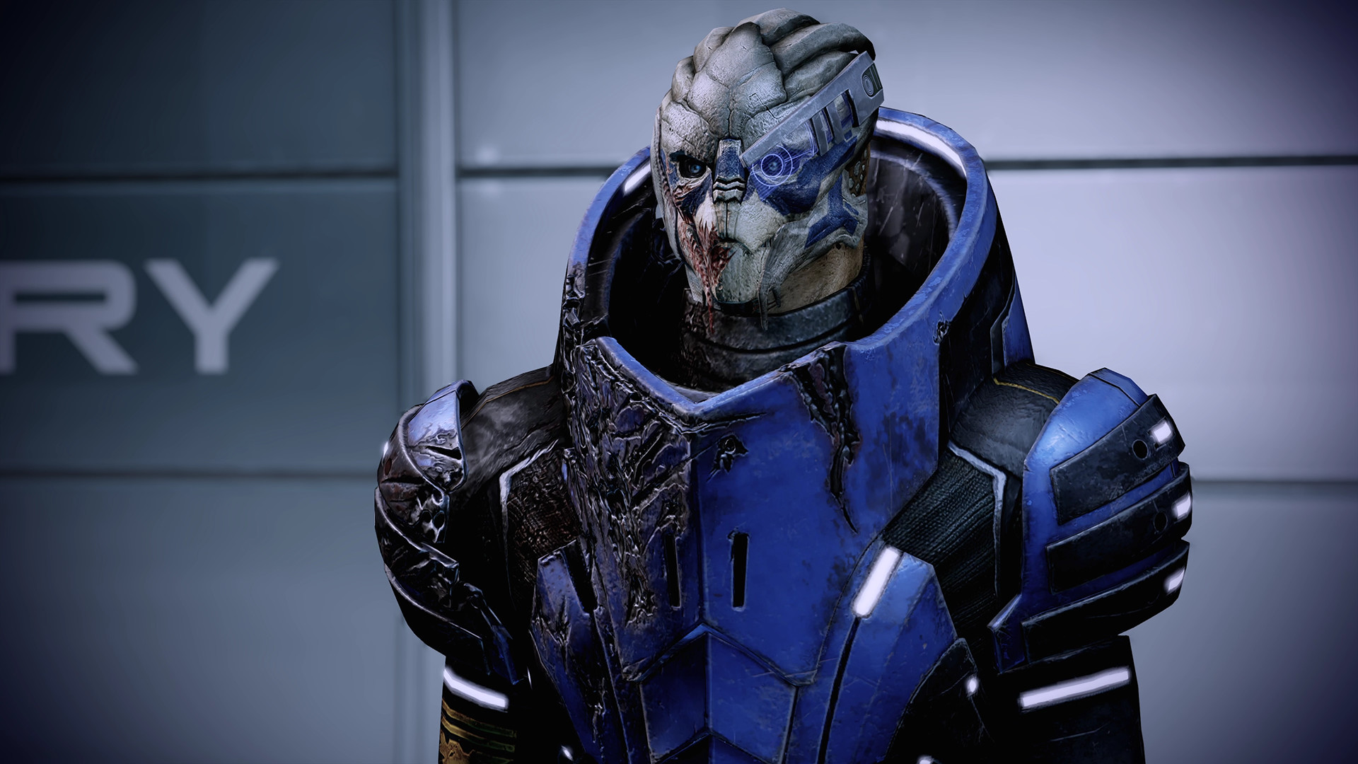 A turian squadmate in scuffed blue armor, a Legendary Edition still.